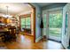 Entryway features hardwood floors and an open concept leading to the dining room and covered front porch at 1655 Stacia Dr, Covington, GA 30016