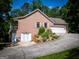 Brick home showcasing a two-car garage and neatly manicured landscaping at 1655 Stacia Dr, Covington, GA 30016