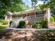 Attractive brick house boasting a large covered porch, elegant landscaping, and classic design at 1655 Stacia Dr, Covington, GA 30016