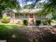 Beautiful brick home with a spacious front yard, welcoming entrance, and a cozy, covered porch at 1655 Stacia Dr, Covington, GA 30016