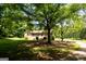 Charming brick home with a sprawling front lawn and mature trees at 1655 Stacia Dr, Covington, GA 30016