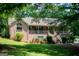 Attractive brick home featuring a welcoming front porch and landscaped yard at 1655 Stacia Dr, Covington, GA 30016