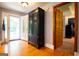 Foyer with hardwood floors, a large antique cabinet, and direct access to the front door at 1655 Stacia Dr, Covington, GA 30016