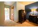 Hallway with carpet floors leads to the main bedroom, showcasing the ensuite bathroom at 1655 Stacia Dr, Covington, GA 30016