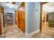 Hallway with wood-look tile flooring, closet, and access to other rooms, creating a seamless transition at 1655 Stacia Dr, Covington, GA 30016