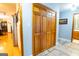 Hallway featuring wood closet and views of the kitchen and bathroom, blending convenience and accessibility at 1655 Stacia Dr, Covington, GA 30016