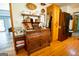 Kitchen nook featuring a decorative cabinet, stainless steel refrigerator, and hardwood flooring at 1655 Stacia Dr, Covington, GA 30016