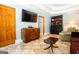 Living room featuring tile floors, a mounted TV, and a stylish dark wood hutch at 1655 Stacia Dr, Covington, GA 30016
