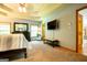 Spacious main bedroom featuring carpet floors and an ensuite bathroom with a TV at 1655 Stacia Dr, Covington, GA 30016