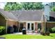Cozy brick patio with outdoor seating and grills, perfect for entertaining at 1655 Stacia Dr, Covington, GA 30016