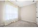 Cozy bedroom featuring carpet flooring and a window with curtains at 1058 Kirkland Cir, Smyrna, GA 30080