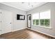 The bedroom showcases a window with blinds, a ceiling fan and laminate floors at 1058 Kirkland Cir, Smyrna, GA 30080