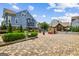 Beautiful community entrance featuring brick-paved road, manicured landscaping and gated entrance at 1058 Kirkland Cir, Smyrna, GA 30080