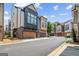 Stylish townhomes feature eye-catching architectural detail with a 2-car garage and neutral color palette at 1058 Kirkland Cir, Smyrna, GA 30080