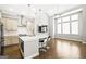Modern kitchen with an island, stainless steel appliances, and hardwood floors at 1058 Kirkland Cir, Smyrna, GA 30080