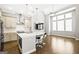 Contemporary kitchen with white countertops, stainless steel appliances, and a view to the bright living area at 1058 Kirkland Cir, Smyrna, GA 30080
