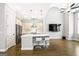 Modern kitchen with an island, stainless steel appliances, and hardwood floors at 1058 Kirkland Cir, Smyrna, GA 30080