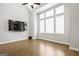 Bright living room with large windows and hardwood floors at 1058 Kirkland Cir, Smyrna, GA 30080