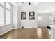 Spacious living room with hardwood floors, high ceilings and modern artwork on the walls at 1058 Kirkland Cir, Smyrna, GA 30080
