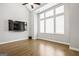Bright living room with high ceilings, hardwood floors, and large windows, offering abundant natural light at 1058 Kirkland Cir, Smyrna, GA 30080