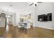 Open-concept living space featuring hardwood floors, high ceilings, and a modern kitchen with an island at 1058 Kirkland Cir, Smyrna, GA 30080