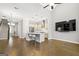 Open concept living area with modern kitchen, island with seating, and stainless steel appliances at 1058 Kirkland Cir, Smyrna, GA 30080