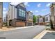 View of modern townhomes featuring unique architectural designs and attached garages at 1058 Kirkland Cir, Smyrna, GA 30080