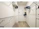 Walk-in closet featuring ample shelving with neutral colored carpet at 1058 Kirkland Cir, Smyrna, GA 30080