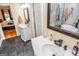 Modern bathroom featuring double sinks, vanity, tile floors, and mirrors at 350 Ridgemont Dr, Fayetteville, GA 30215