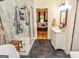 Bathroom featuring a glass enclosed shower and vanity with marble wall at 350 Ridgemont Dr, Fayetteville, GA 30215