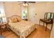 Cozy bedroom with bamboo floors, floral comforter, and natural light at 350 Ridgemont Dr, Fayetteville, GA 30215