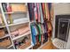 Spacious walk-in closet with shelving, clothes, and a Field & Stream safe at 350 Ridgemont Dr, Fayetteville, GA 30215