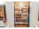Organized closet with shelving, baskets, and stylish lighting fixtures at 350 Ridgemont Dr, Fayetteville, GA 30215