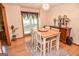 Dining room with a table and chairs under modern light fixture at 350 Ridgemont Dr, Fayetteville, GA 30215
