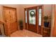Inviting foyer featuring a decorative glass front door, hardwood flooring, and stylish interior decor at 350 Ridgemont Dr, Fayetteville, GA 30215
