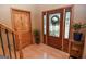 Welcoming foyer with hardwood floors, decorative glass door, interior door and stylish accents at 350 Ridgemont Dr, Fayetteville, GA 30215