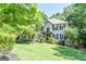 Beautifully landscaped front yard featuring a two-story house with black shutters and a well-manicured lawn at 350 Ridgemont Dr, Fayetteville, GA 30215