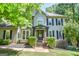 Charming two-story home with a welcoming front porch, a well-maintained lawn, and a traditional architectural style at 350 Ridgemont Dr, Fayetteville, GA 30215