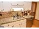 Well-lit kitchen featuring granite countertops, stainless steel appliances, and white cabinetry at 350 Ridgemont Dr, Fayetteville, GA 30215