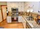 Updated kitchen featuring granite countertops and stainless steel appliances at 350 Ridgemont Dr, Fayetteville, GA 30215