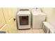 Convenient laundry room featuring a Samsung washer and dryer set with tiled floors at 350 Ridgemont Dr, Fayetteville, GA 30215