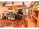 Spacious living room features hardwood floors, a large TV, and comfortable leather seating at 350 Ridgemont Dr, Fayetteville, GA 30215