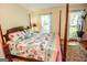 Bedroom with a four poster bed, bright window, and an area rug at 350 Ridgemont Dr, Fayetteville, GA 30215