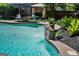 Close-up of the refreshing pool featuring a decorative water feature and well-manicured surrounding greenery at 350 Ridgemont Dr, Fayetteville, GA 30215