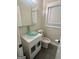 This half bathroom features a vanity with a clear glass vessel sink at 6072 Holiday Blvd, Forest Park, GA 30297
