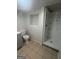 This basement bathroom features a tiled shower, vanity, and toilet at 6072 Holiday Blvd, Forest Park, GA 30297