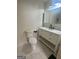 Modern bathroom features a sleek vanity with marble countertop and white cabinets at 6072 Holiday Blvd, Forest Park, GA 30297