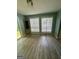 Bright dining room with wood flooring, built-in cabinet and lots of natural light at 6072 Holiday Blvd, Forest Park, GA 30297