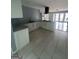 Modern kitchen with granite countertops, stainless steel appliances, and white cabinetry at 6072 Holiday Blvd, Forest Park, GA 30297