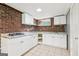 Bright kitchen with white cabinets, updated countertops and stainless steel appliances at 6072 Holiday Blvd, Forest Park, GA 30297